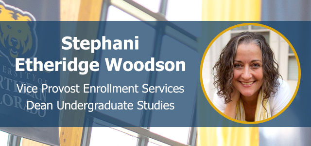 Photo of Stephani Etheridge Woodson facing front and smiling on a background with UNC's logo.