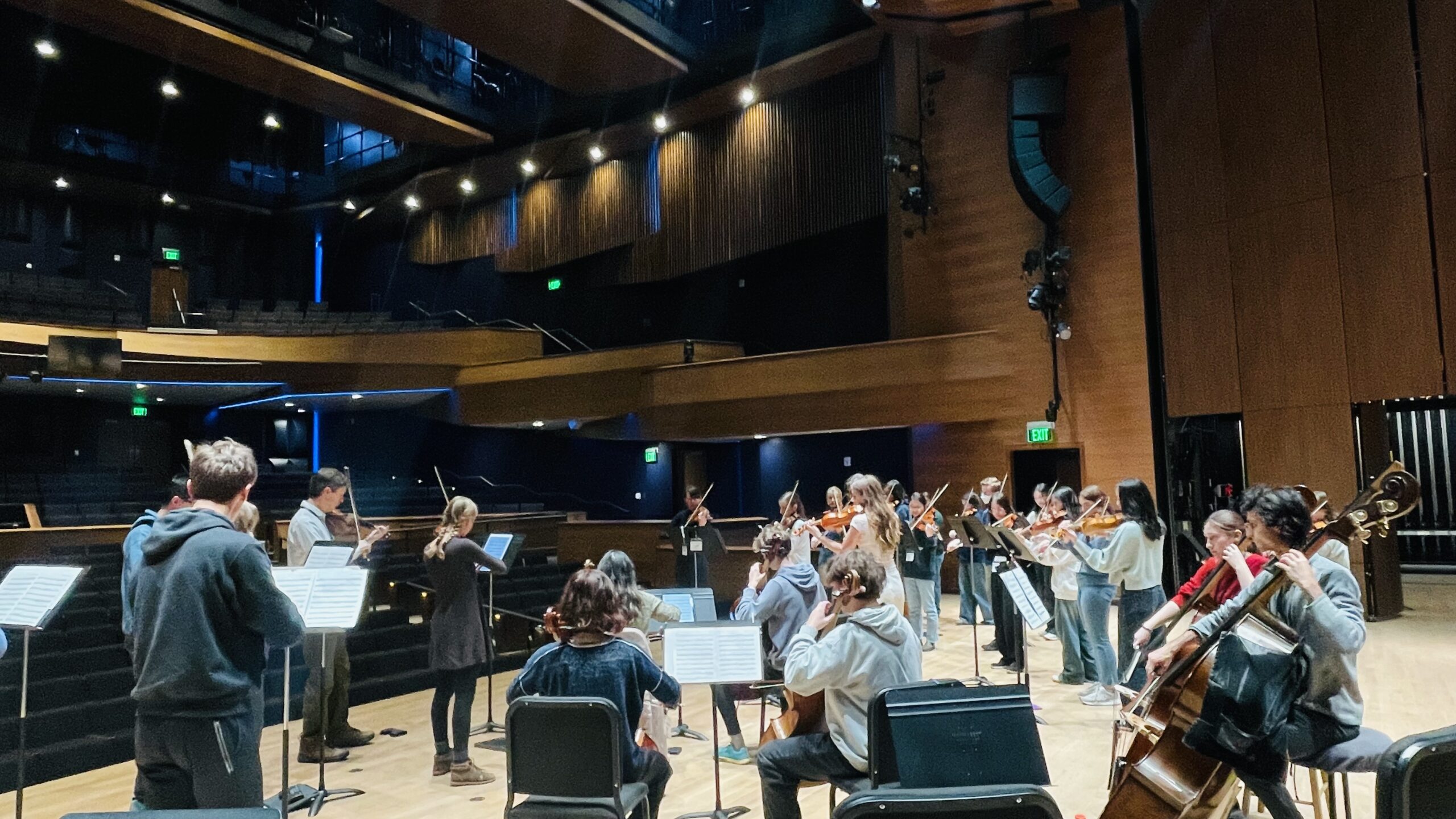 Students rehearsing on stage at Western States Honor Orchestra Festival.