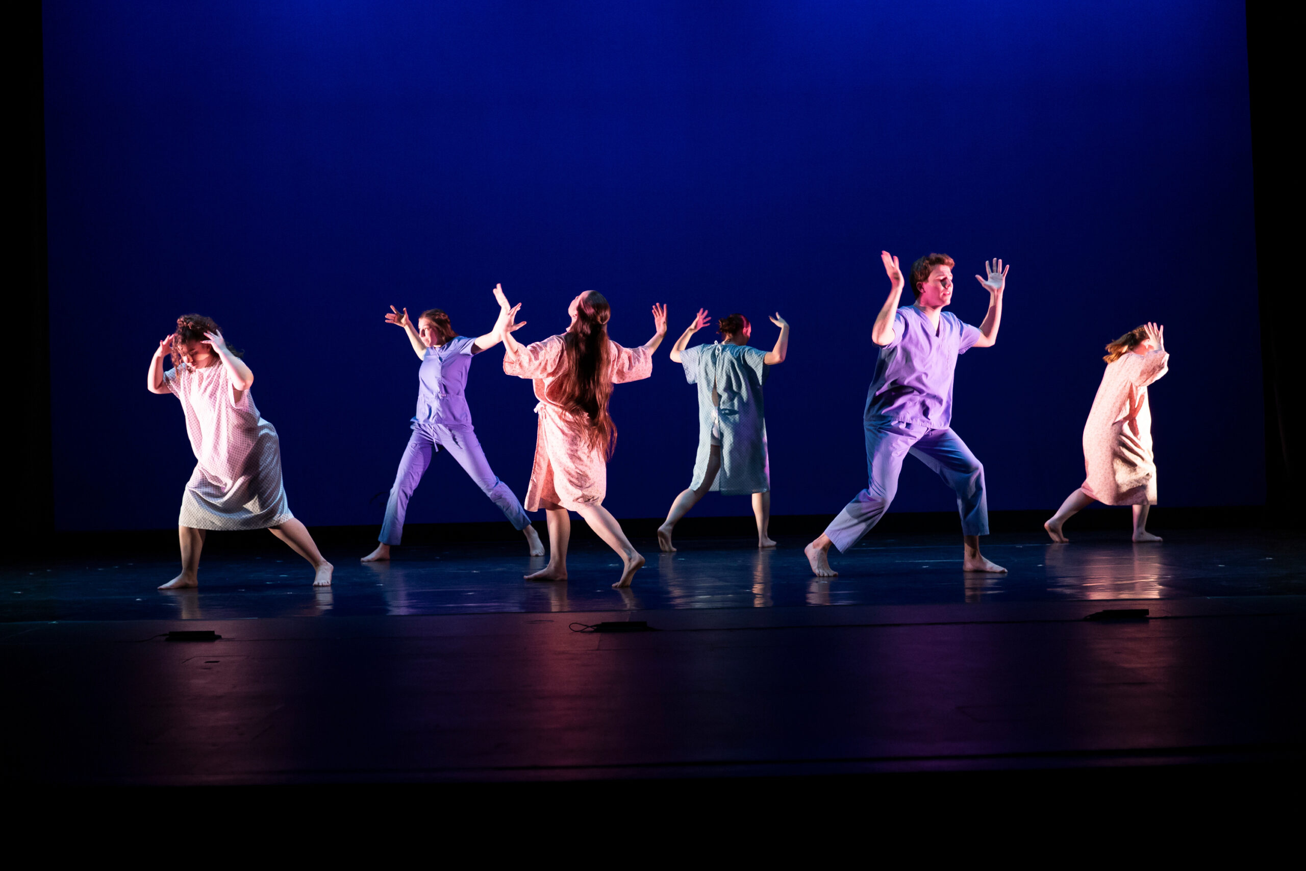Dancers on stage in On City Life and Longing dance concert.