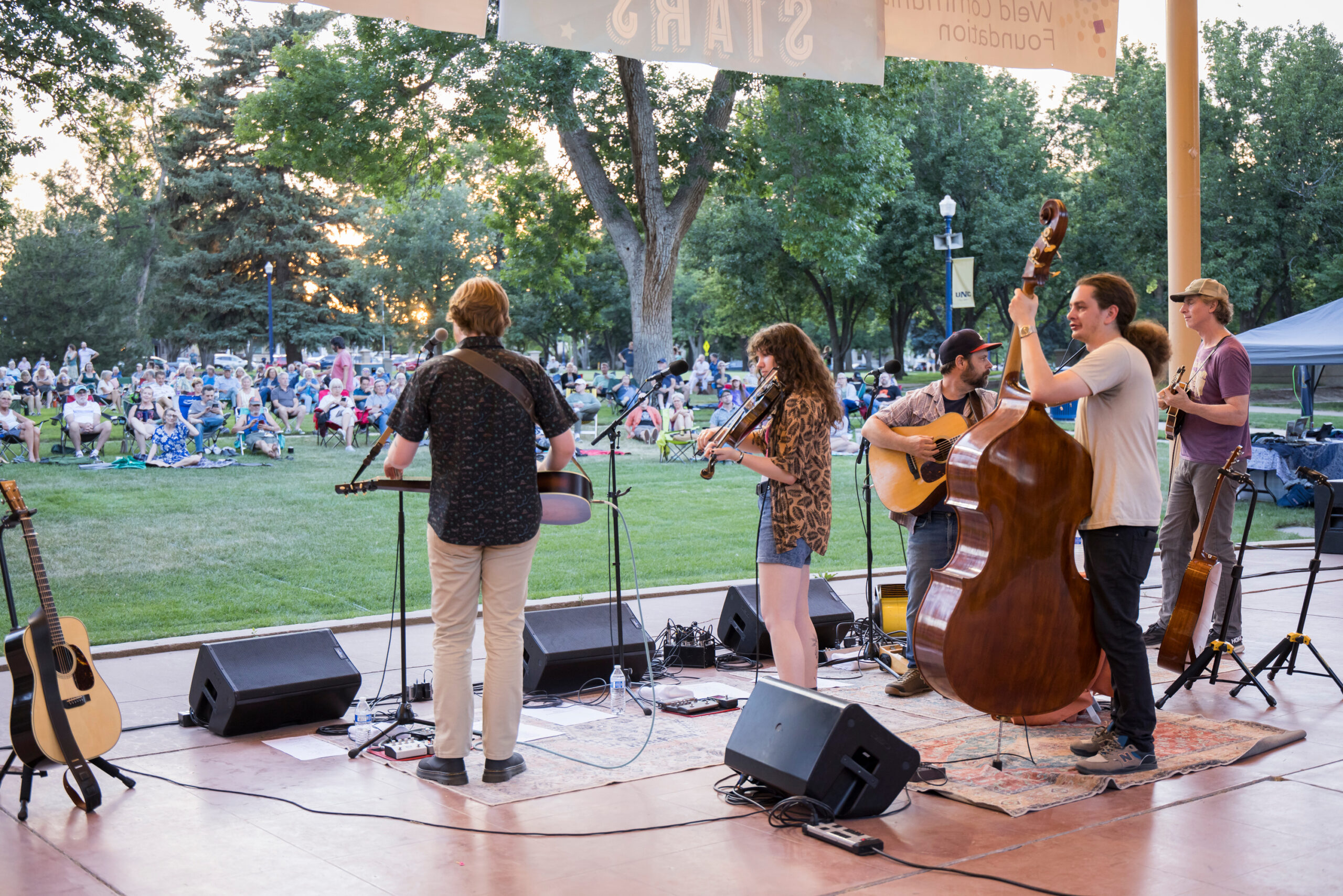 High Lonesome bluegrass band performing on stage at Garden Theatre for Concerts Under the Stars.