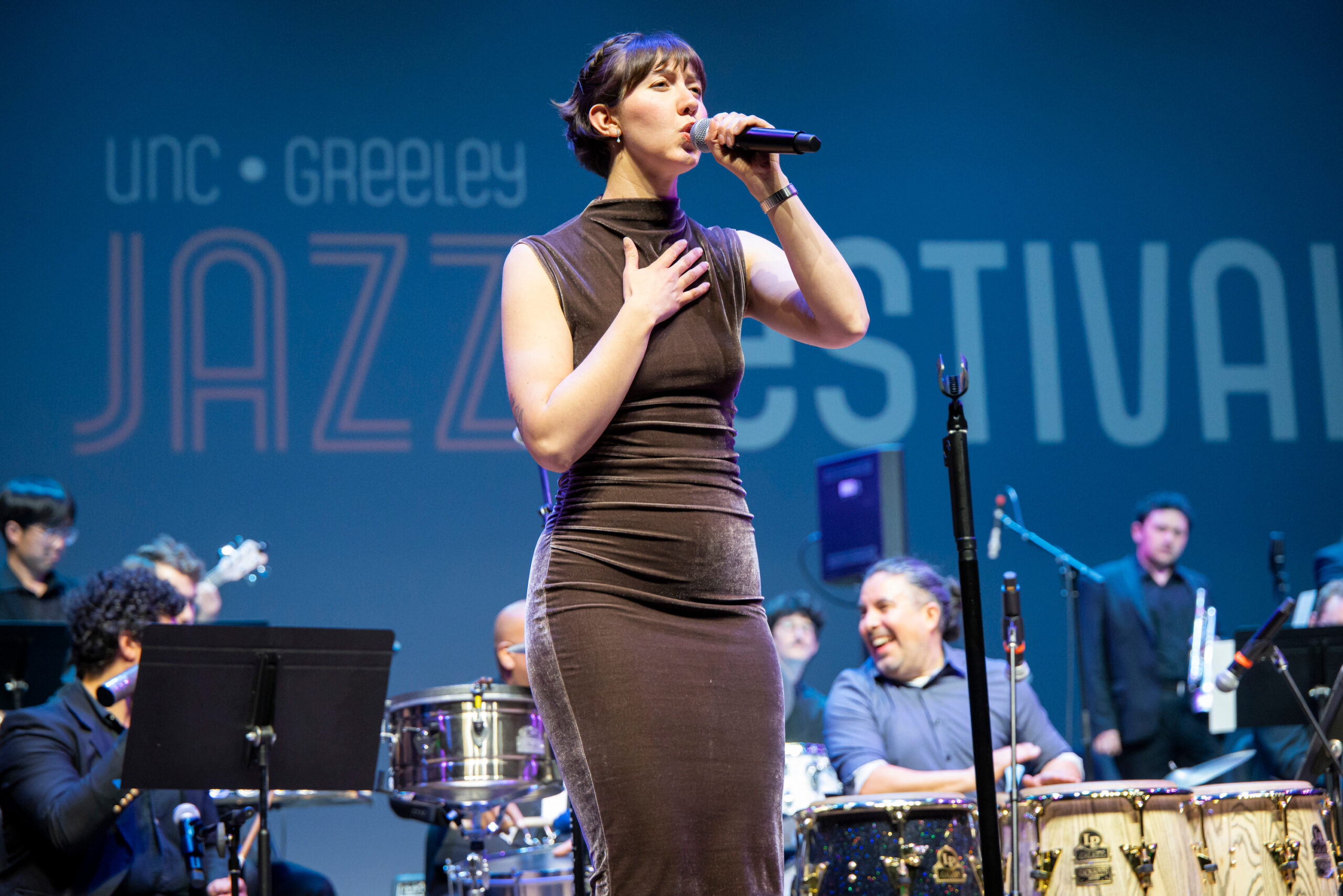 Jazz vocalist Hannah Rodriguez singing on stage.