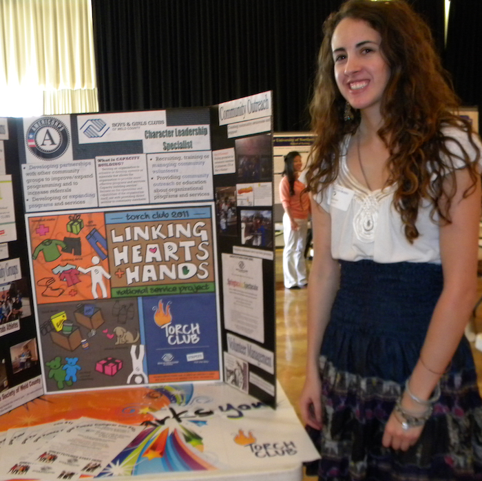 Image of student presenting an Americorps project poster