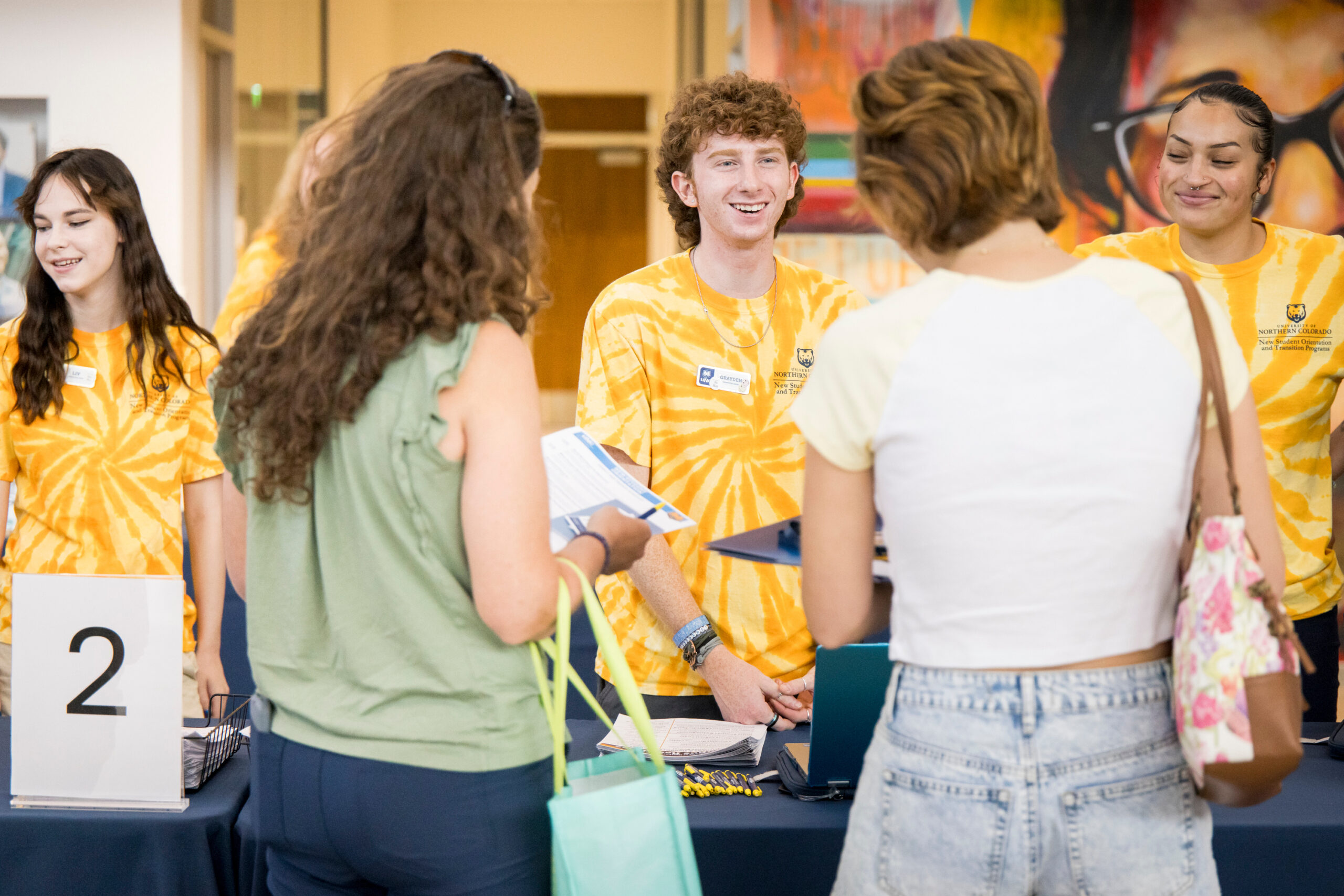 Student Affair students help incoming students check in for New Student Orientation