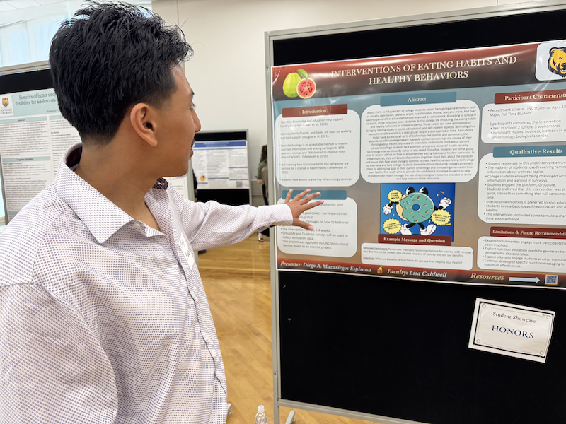 Student presenting poster at 2025 Student Showcase