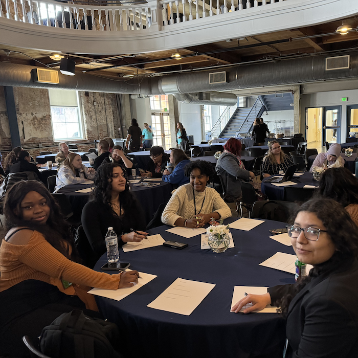 Students sitting at round tables at Western Regional Honors Conference