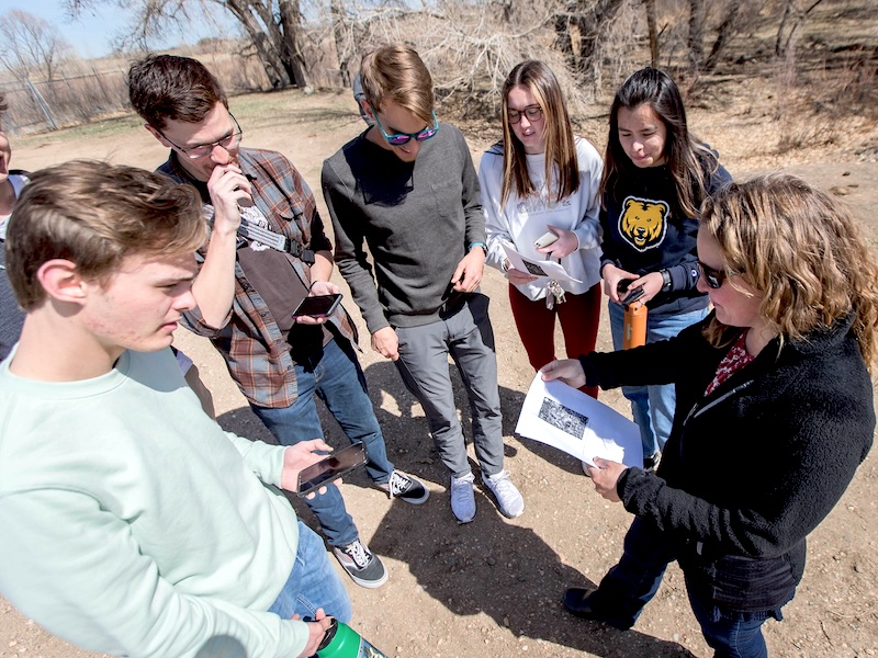 Faculty leading mapping fieldwork with Geography students