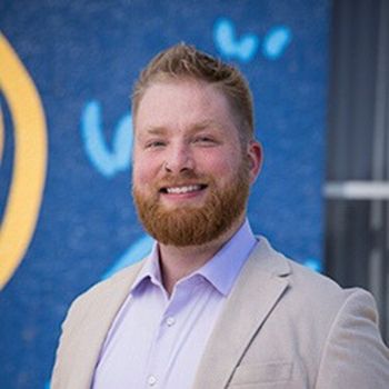 A professional headshot of Shane Borah