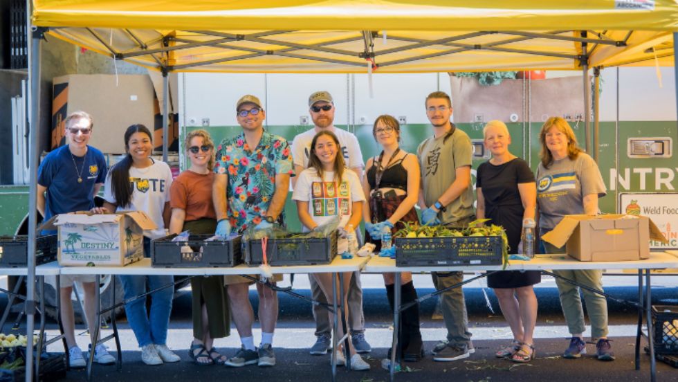 Volunteers pose for a photo at a mobile food pantry