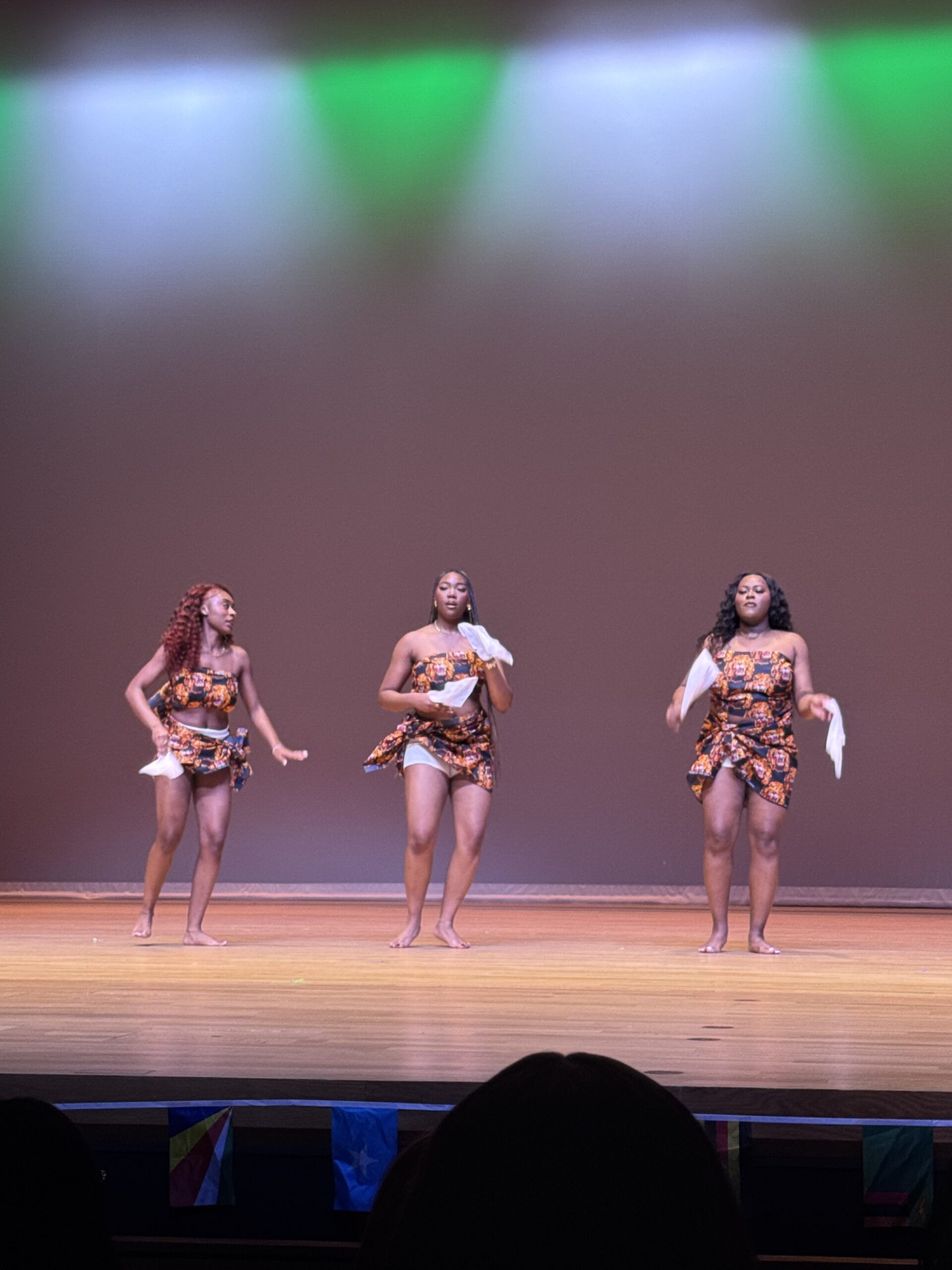 Three students performing at the UNC stage for Black Heritage Month