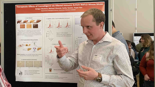 Bridger Menlove presenting his honors research poster at UNC Research Day.