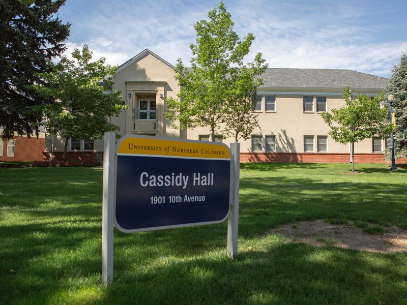 Exterior of Cassidy Hall showcasing a sign which reads 