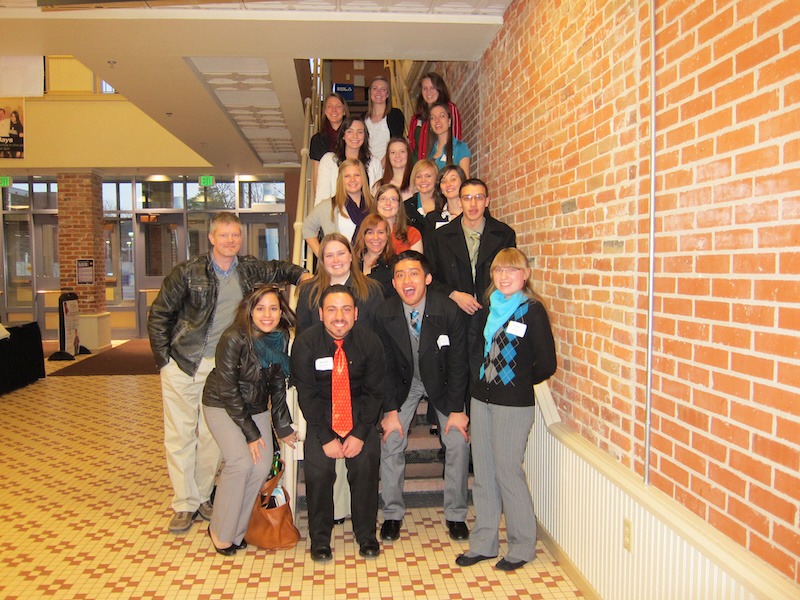 Group of students posing on stairwell at Colorado Leadership Alliance conference
