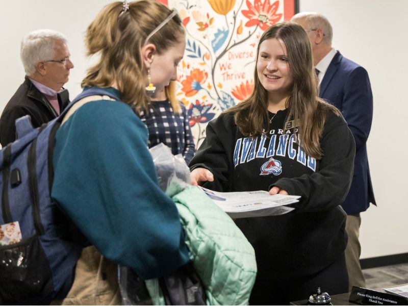 A Resource Navigator describes their services to a student