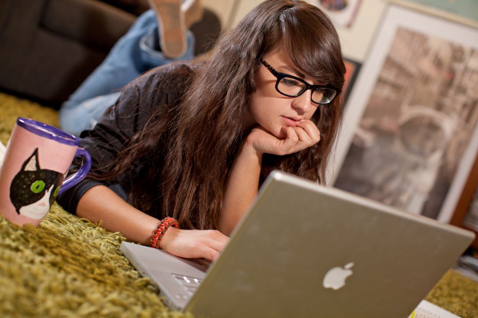 Student focused on computer