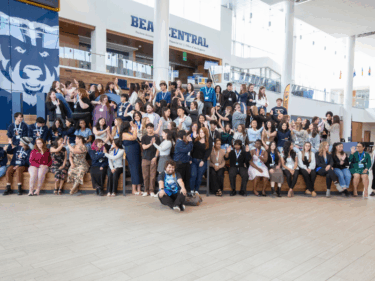 A large group of scholarship recipients pose for a photo