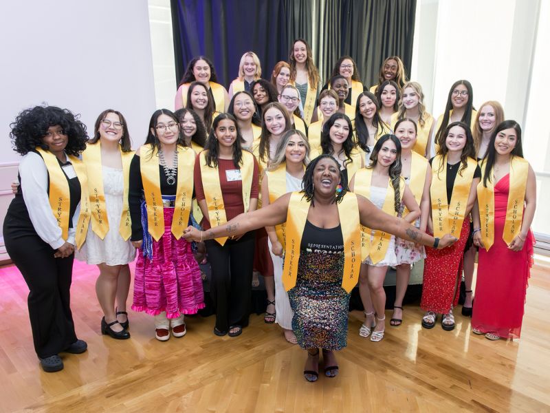 Stryker scholars pose for a group photo at a banquet
