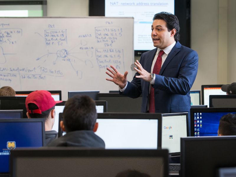 Students listen to a lecture in a classroom.