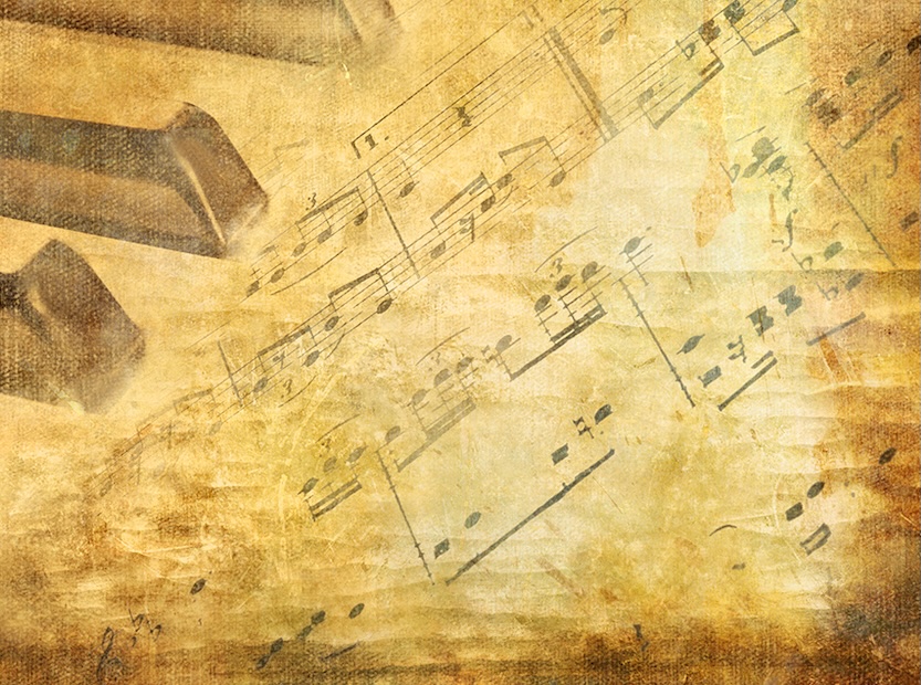 Piano keys against a musical composition