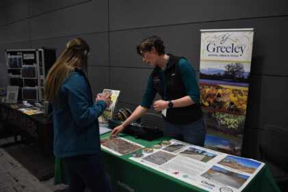 Two people at the Poudre River Forum