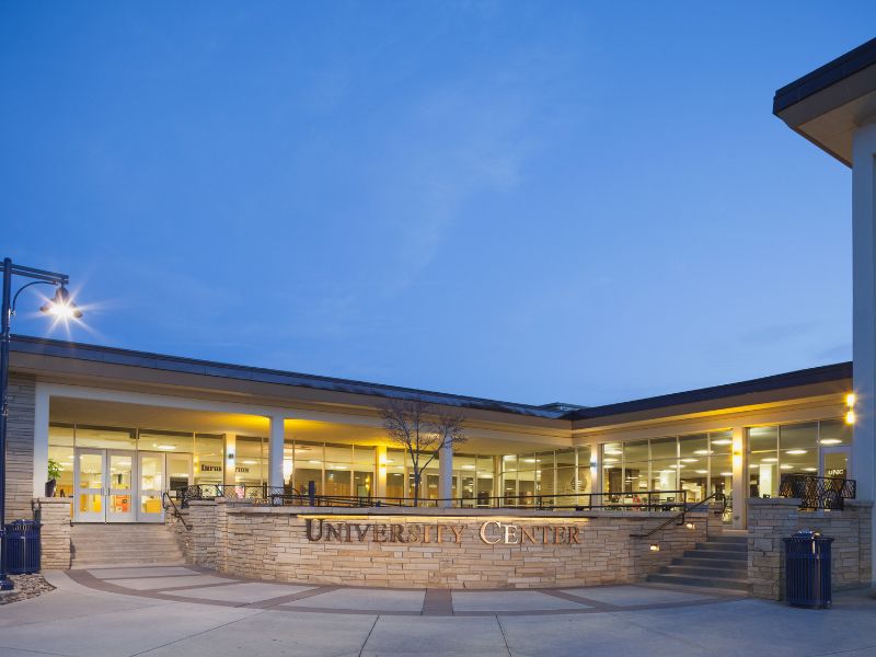 The University Center sign at dusk