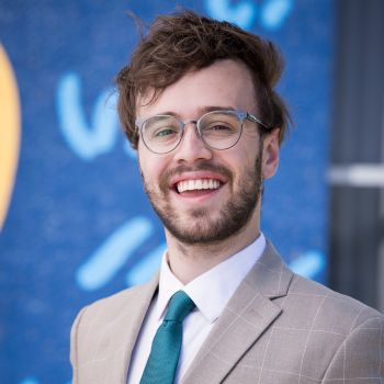 A professional headshot of Jonah Ausbun