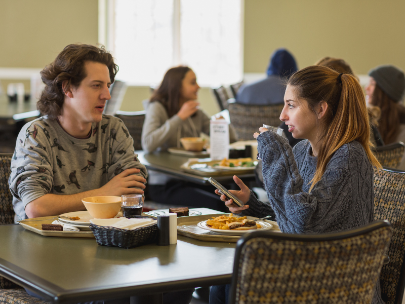 Two students enjoy a meal