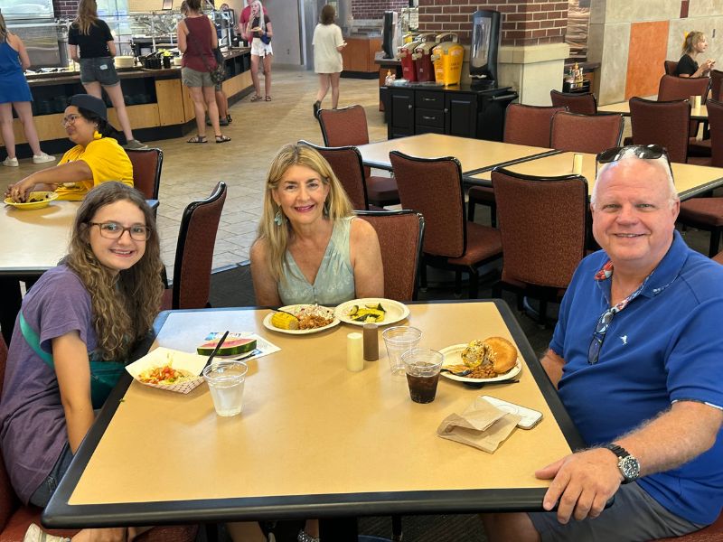 Parents enjoy a meal with their student at Holmes Dining Hall
