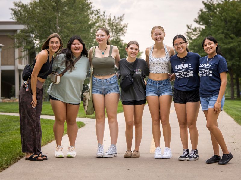 Students pose for a group photo on campus