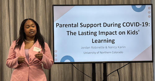 Jordan Robinette presenting her PowerPoint at Student Showcase for Artists and Scholars.