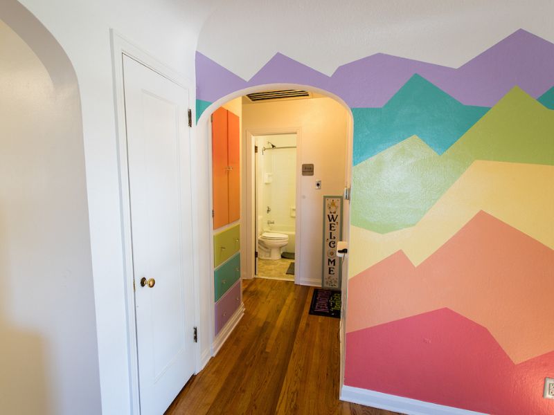 A colorful mural on the living room wall in Berkenkotter