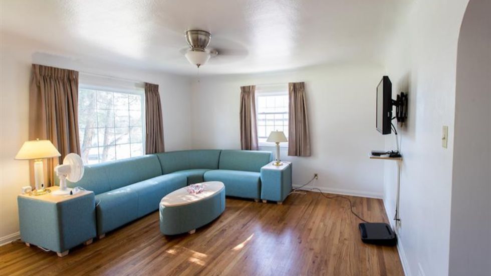 Berkenkotter living room featuring a stylish blue sofa
