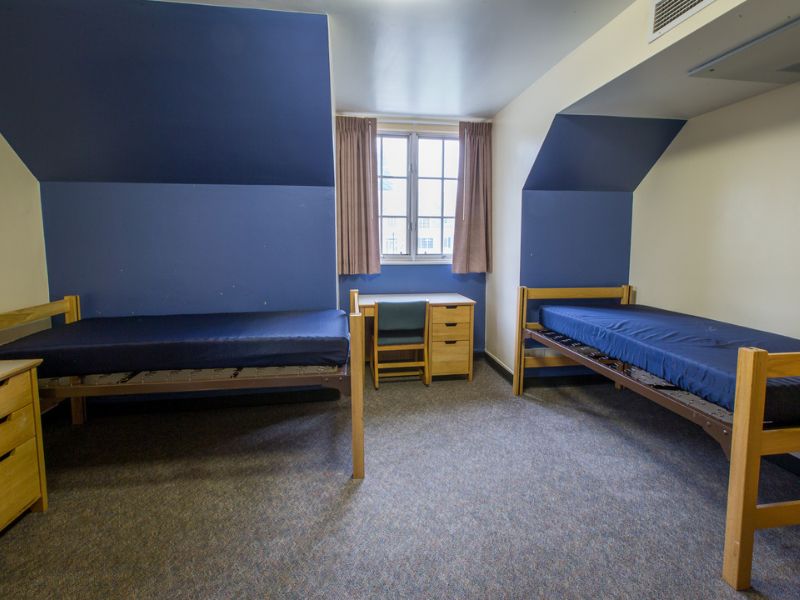 A bright and inviting room in Gordon Hall featuring blue accent walls.