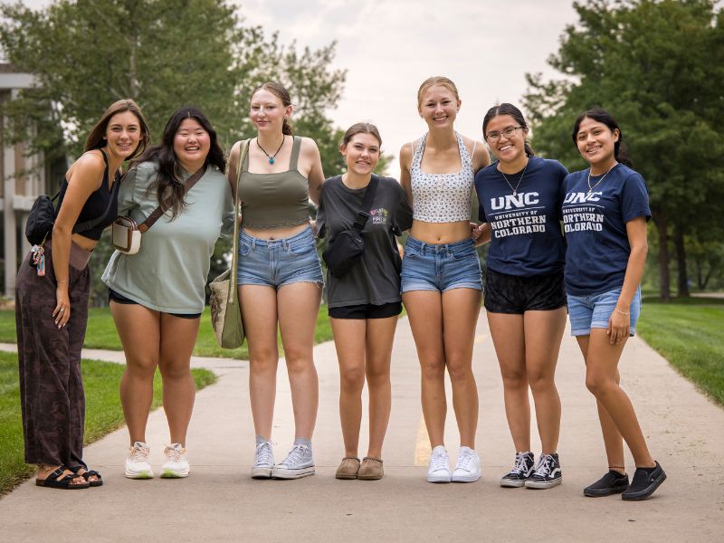 Students pose for a group photo on move-in day