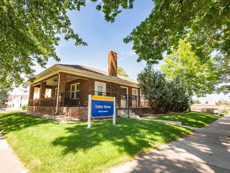 Trotter house's exterior is a brick building with a large front porch.