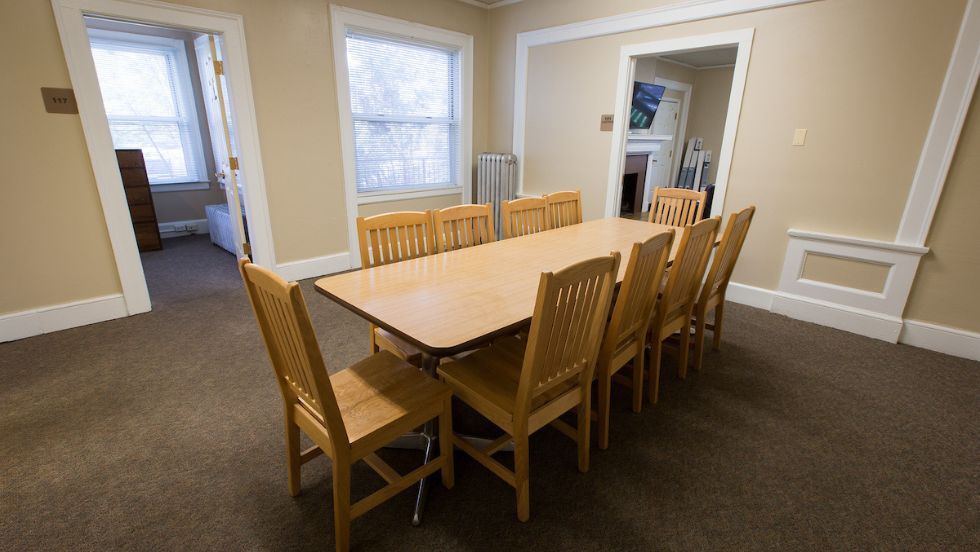 Trotter house features a dinner table with ten seats.