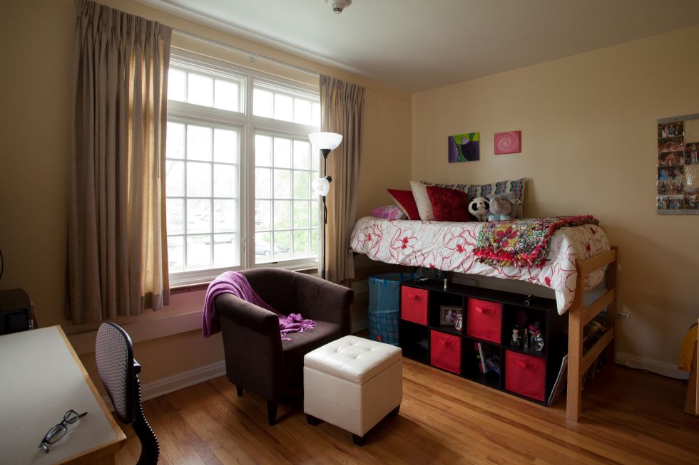 Interior of room with bunk bed showing storage underneath