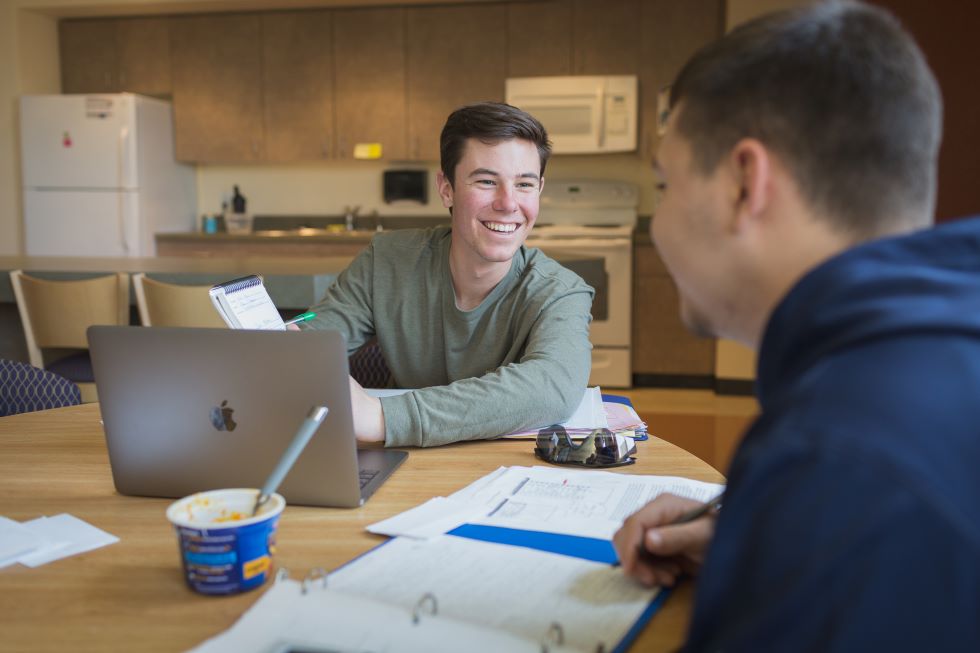 Students Chatting Doing Homework