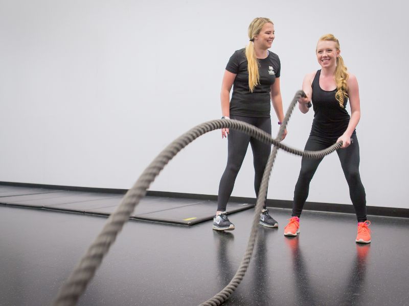 Two students engage in a personal training session