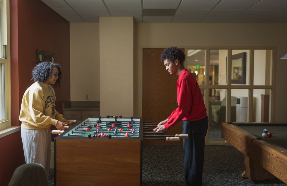 Students Playing Foosball