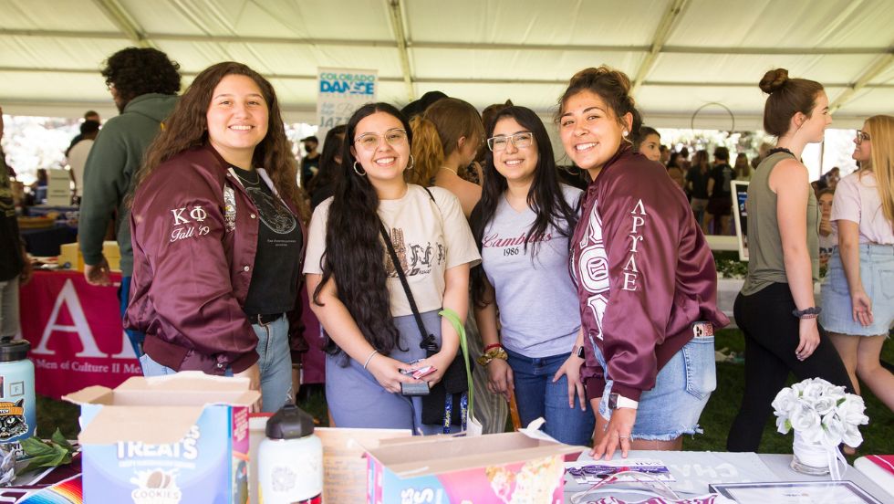 Members of a sorority pose for a photo at Involvement Fair