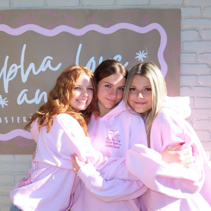 Members of Alpha Fhi pose for a group photo at a recruitment event