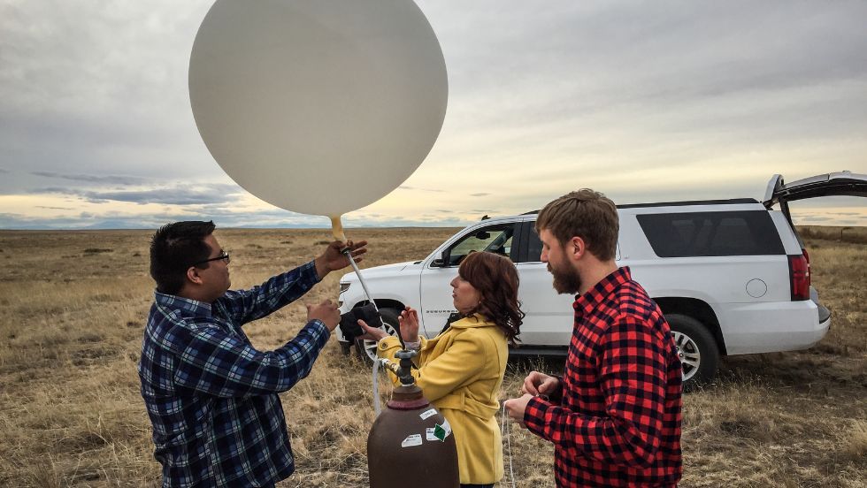 Students conducting an experiment using a weather balloon