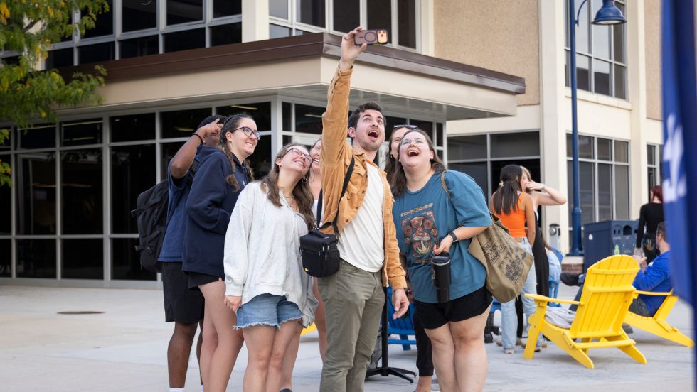 Students pose for a selfie during a Student Affairs event