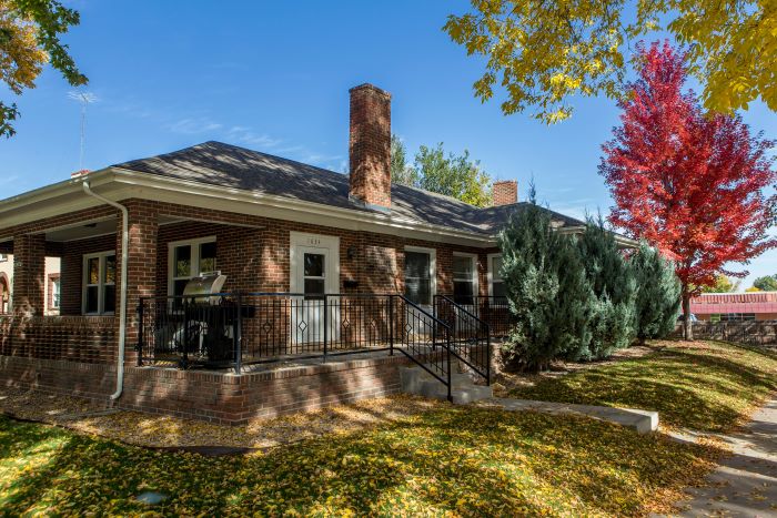 Trotter House Exterior with bright red autumn tree