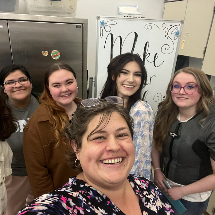 Art education students posing in photo with Abi Paytoe Gbayee, Art Education faculty.