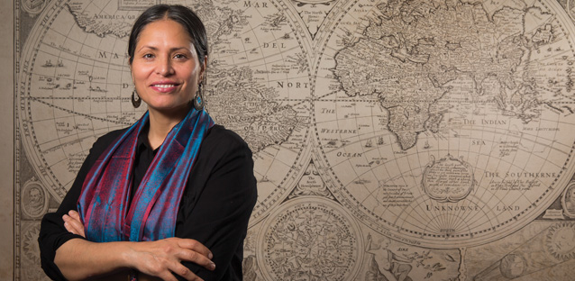 Ather Zia in front of a global map