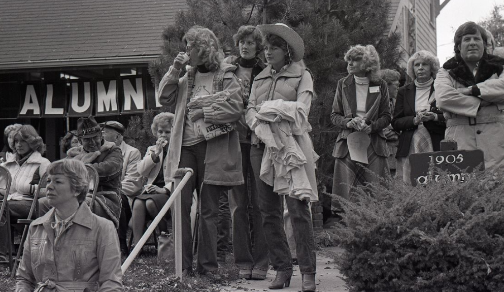 A previous UNC homecoming with people gathering wearing coats