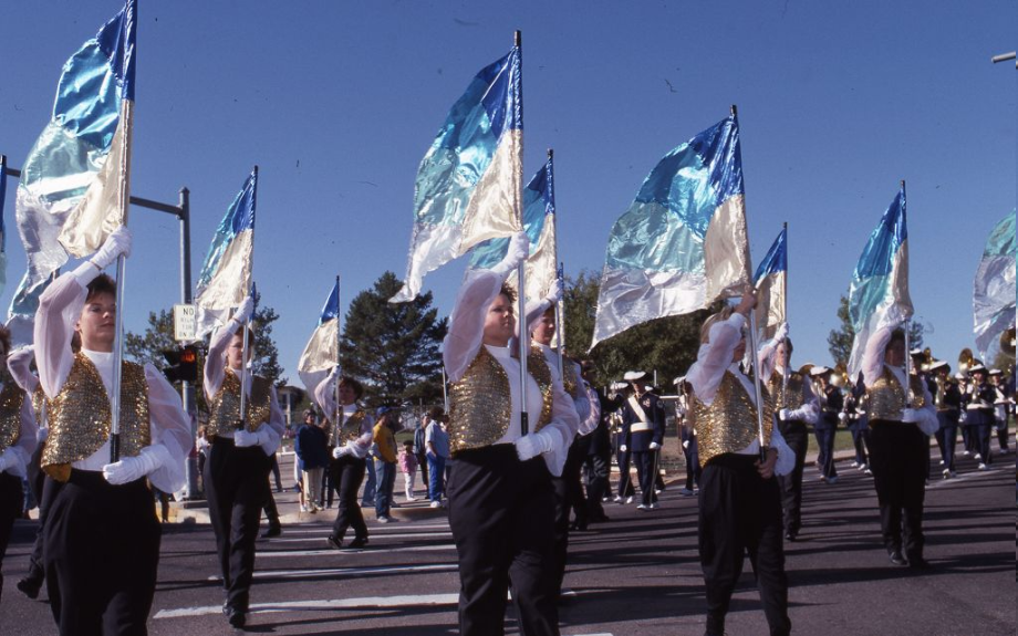 Previous flag ladies marching in a parade