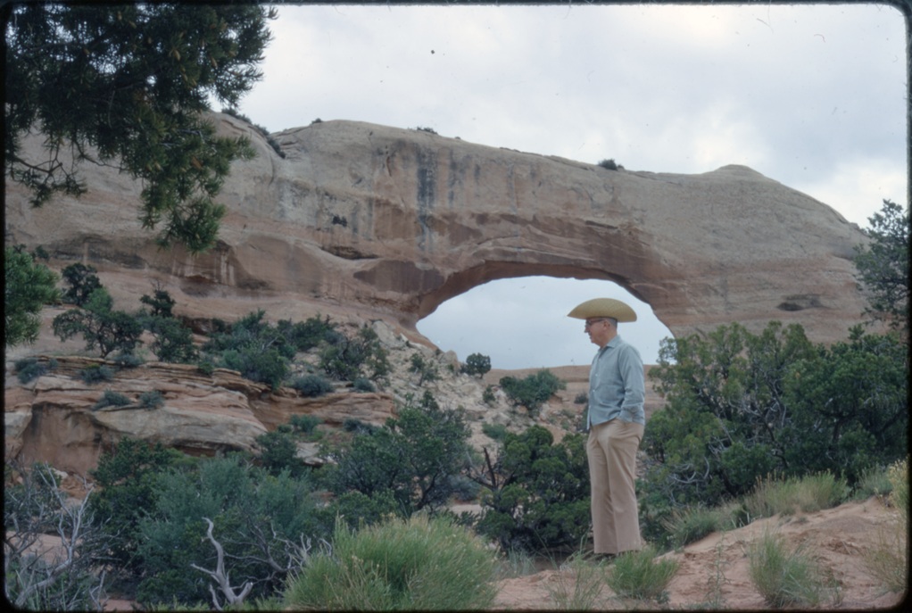 James A. Michener standing in front of an arch at Arches National Park