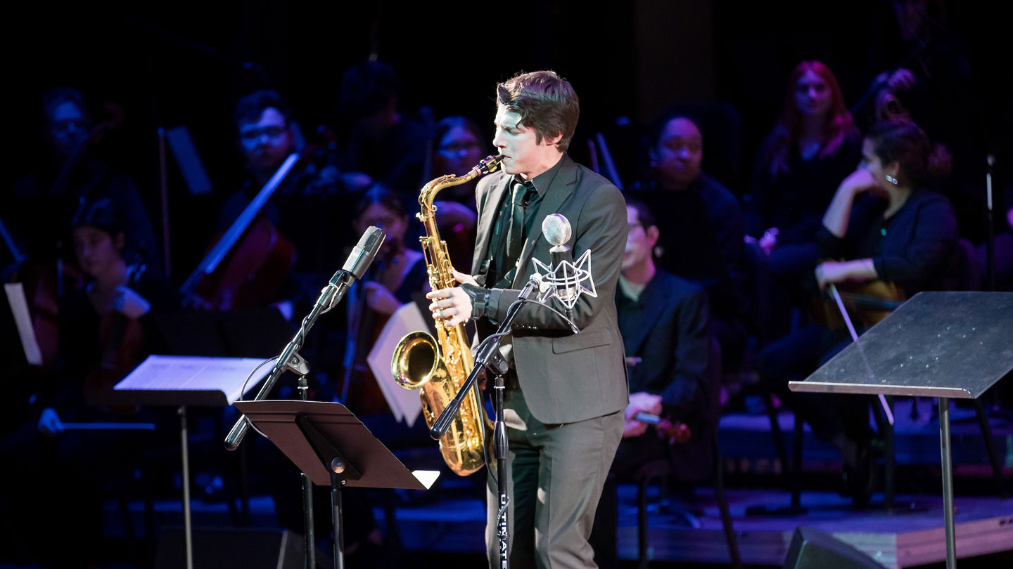 Jazz saxophonist playing a solo.